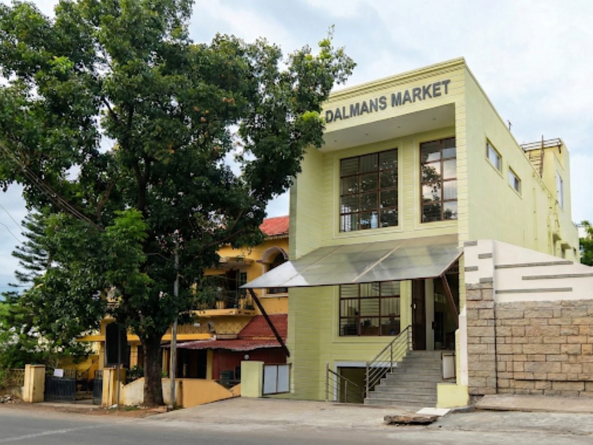 Commercial building on NRT Main Road, Theni with 21 ft road frontage — Dalmans Market at basement level